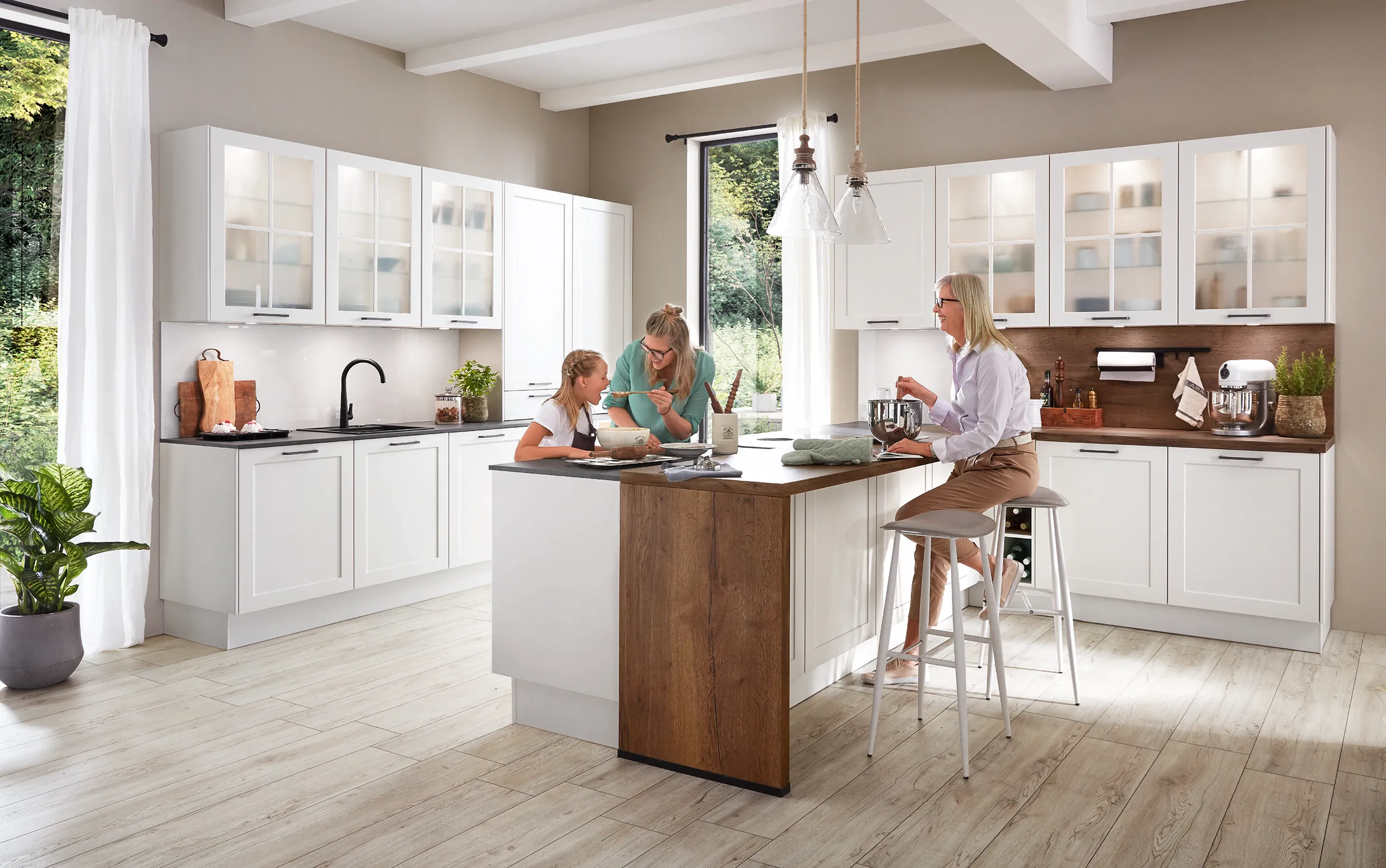 Family enjoying a spacious kitchen with a central island, white cabinets, and wood accents, highlighting the pros and cons of kitchen islands. Family enjoying a spacious kitchen with a central island, white cabinets, and wood accents, highlighting the pros and cons of kitchen islands.