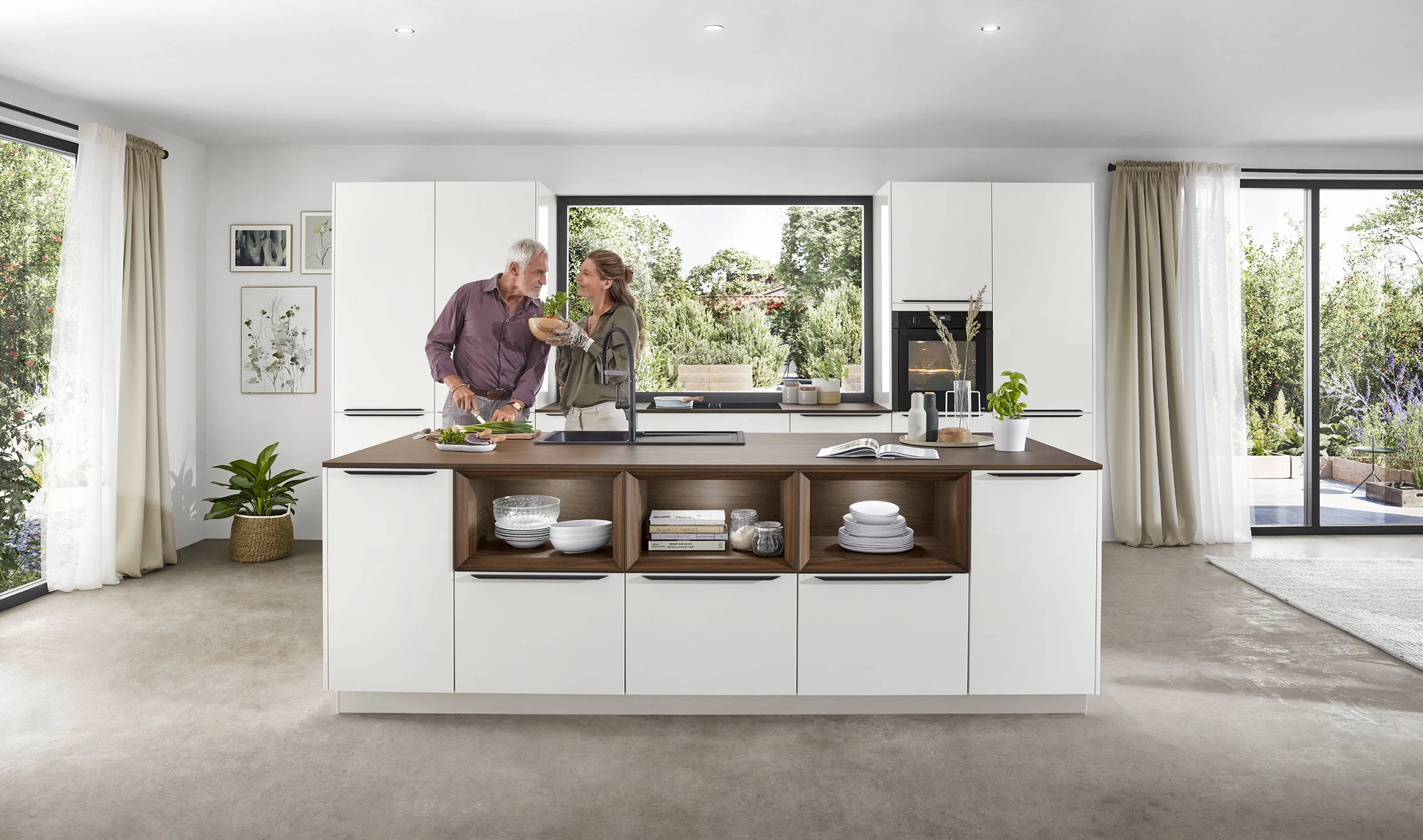 Spacious kitchen with a large island, open shelves, and ample storage, designed to maximize space and functionality. Spacious kitchen with a large island, open shelves, and ample storage, designed to maximize space and functionality.